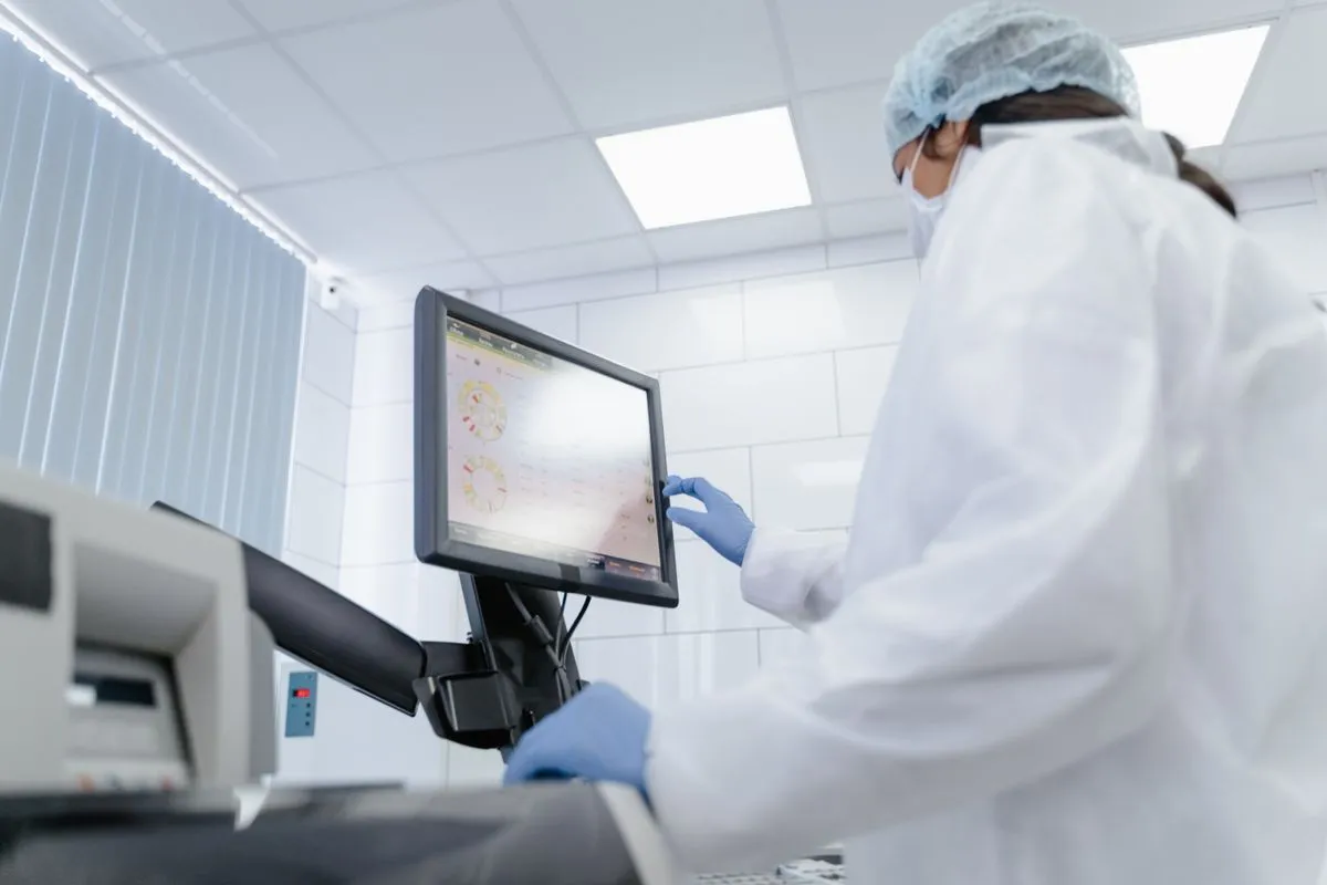 Biomedical technician repairing medical equipment